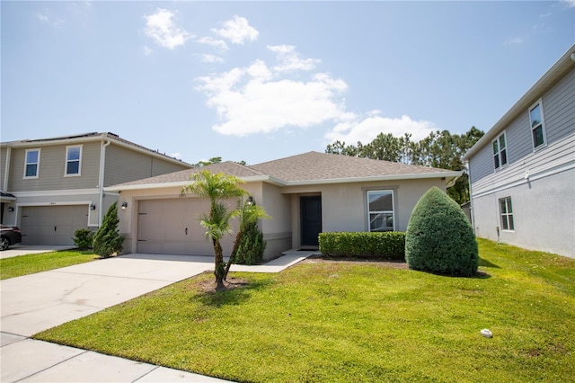 13851 Rushing Creek Run, Orlando, FL 32824 - view of front of home with stucco siding, concrete driveway, a front yard, a shingled roof, and a garage