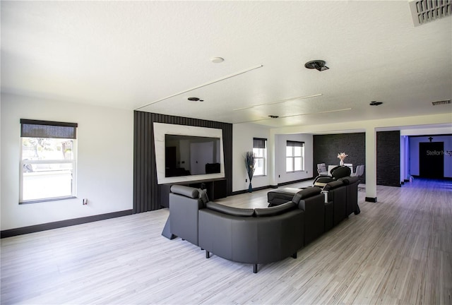 13851 Rushing Creek Run, Orlando, FL 32824 - living area featuring light wood-style floors and baseboards