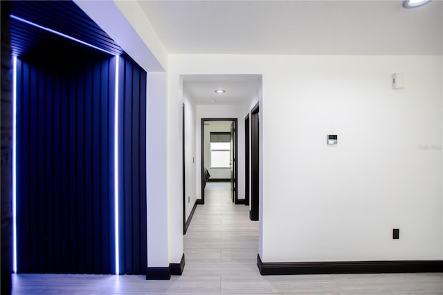 13851 Rushing Creek Run, Orlando, FL 32824 - hall with baseboards and light wood-style flooring