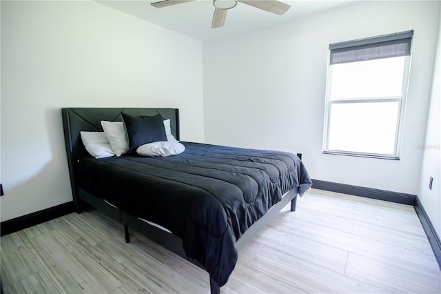 13851 Rushing Creek Run, Orlando, FL 32824 - bedroom with wood finished floors, baseboards, and a ceiling fan