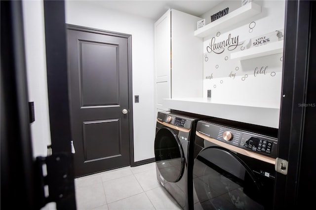 13851 Rushing Creek Run, Orlando, FL 32824 - washroom with washing machine and dryer, cabinet space, and light tile patterned floors