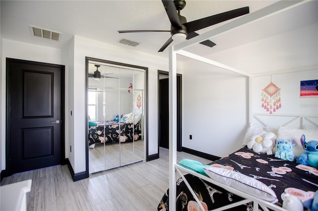 13851 Rushing Creek Run, Orlando, FL 32824 - bedroom featuring baseboards, a ceiling fan, and a closet