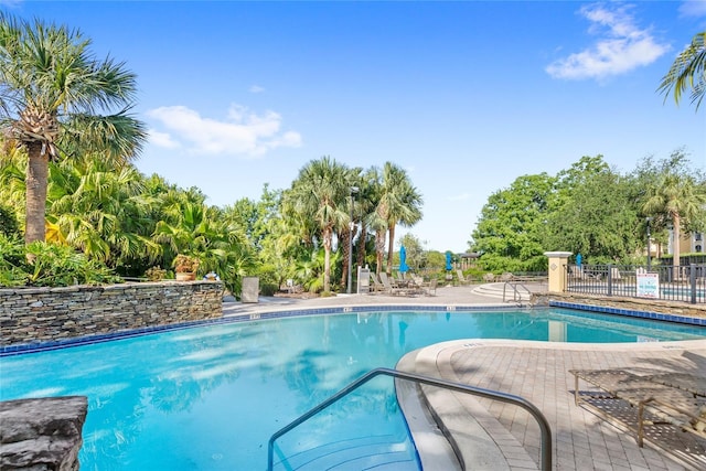community pool featuring fence