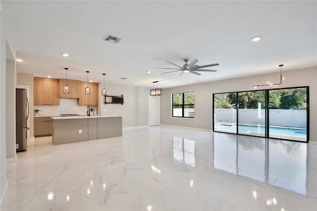934 Jessamy St, Oviedo, FL 32765 - unfurnished living room featuring recessed lighting, a ceiling fan, a chandelier, baseboards, and light marble finish flooring
