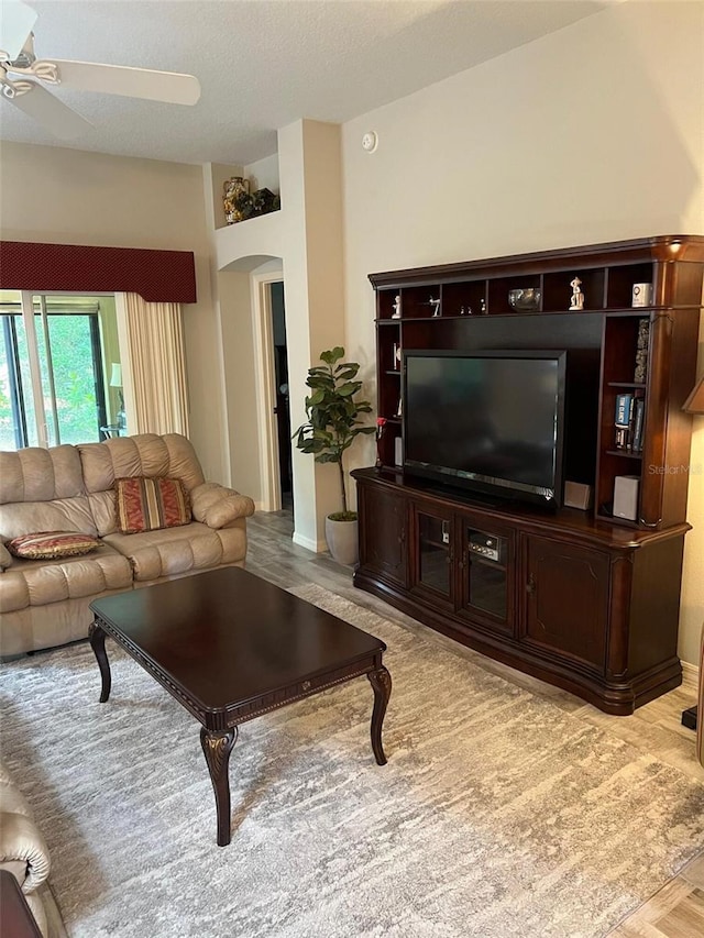 1121 Alcove Loop, The Villages, FL 32162 - living area with arched walkways and ceiling fan