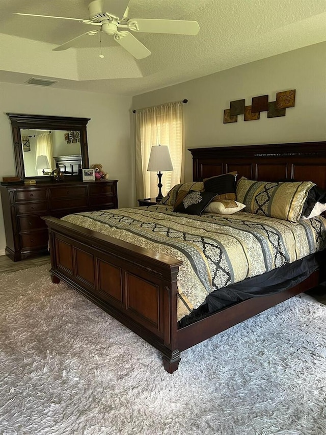 1121 Alcove Loop, The Villages, FL 32162 - bedroom with carpet floors and a ceiling fan