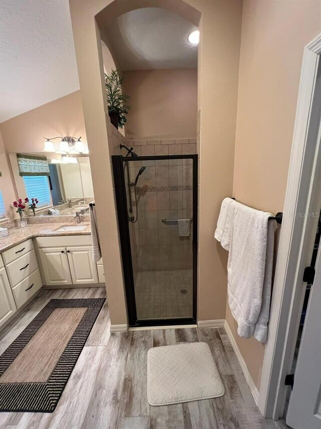 1121 Alcove Loop, The Villages, FL 32162 - full bath featuring a stall shower, wood finished floors, and vanity