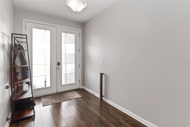 1265 Blarney St, Minneola, FL 34715 - doorway to outside with french doors, dark wood-style floors, and baseboards