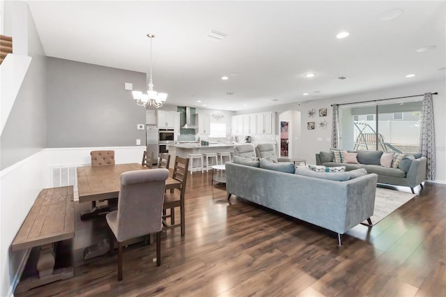 1265 Blarney St, Minneola, FL 34715 - living room featuring a chandelier, dark wood-style floors, and recessed lighting
