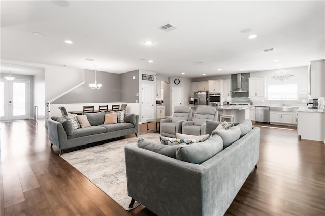 1265 Blarney St, Minneola, FL 34715 - living room with a chandelier, healthy amount of natural light, dark wood finished floors, and recessed lighting