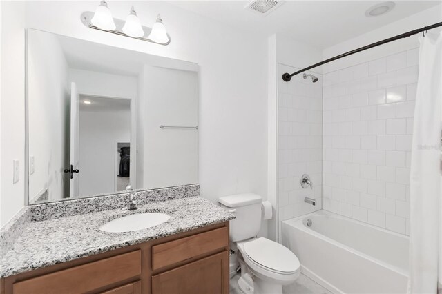 1265 Blarney St, Minneola, FL 34715 - bathroom with toilet, vanity, and shower / bath combination with curtain