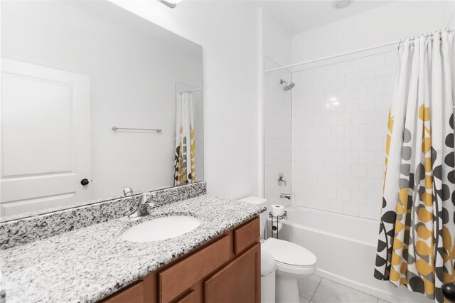 1265 Blarney St, Minneola, FL 34715 - bathroom with toilet, tile patterned floors, shower / bathtub combination with curtain, and vanity