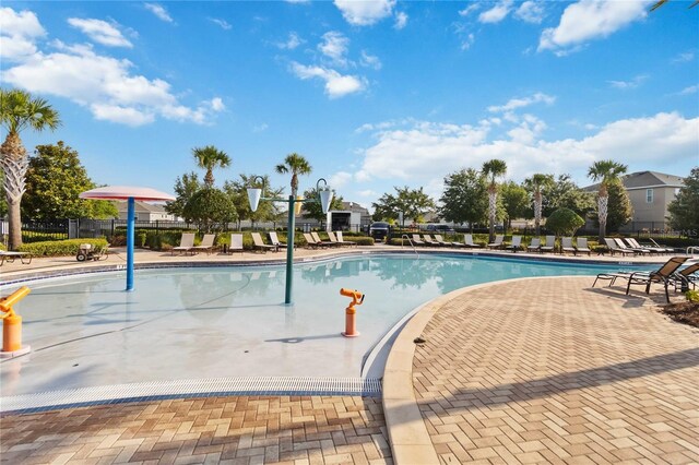 1265 Blarney St, Minneola, FL 34715 - community pool with a patio