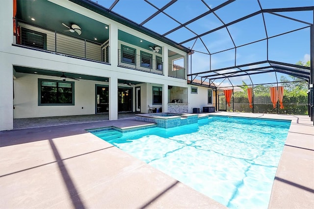 3844 Bowfin Trl, Kissimmee, FL 34746 - view of swimming pool with ceiling fan, a patio, a pool with connected hot tub, and glass enclosure