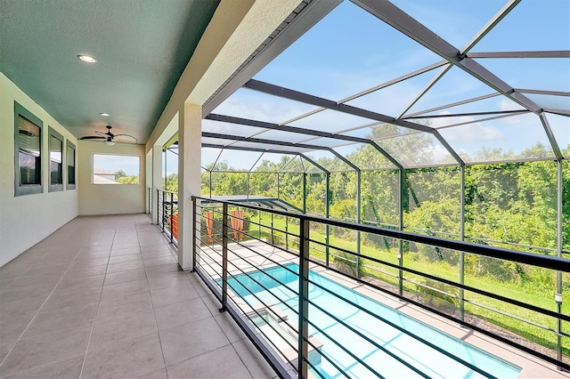 3844 Bowfin Trl, Kissimmee, FL 34746 - balcony featuring a sunroom, ceiling fan, and view of pool
