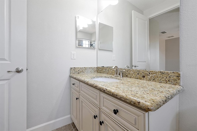 3844 Bowfin Trl, Kissimmee, FL 34746 - bathroom with vanity and baseboards