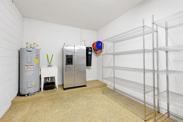 3844 Bowfin Trl, Kissimmee, FL 34746 - interior space with stainless steel fridge with ice dispenser and water heater