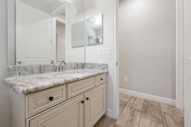 3844 Bowfin Trl, Kissimmee, FL 34746 - bathroom featuring baseboards and vanity