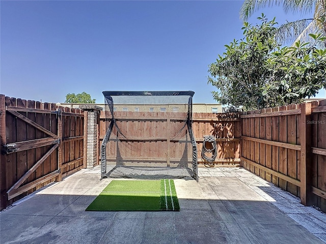 view of patio / terrace with a fenced backyard and a gate