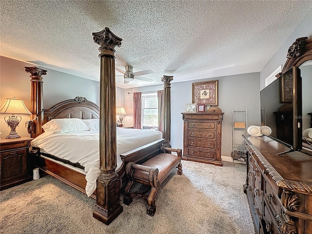 carpeted bedroom featuring a ceiling fan and a textured ceiling