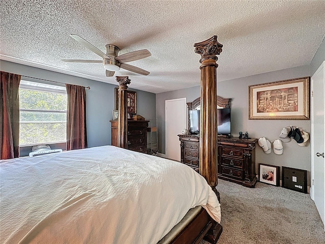 bedroom with carpet flooring, ceiling fan, and a textured ceiling