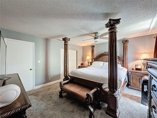 bedroom featuring ornate columns, carpet, and a ceiling fan