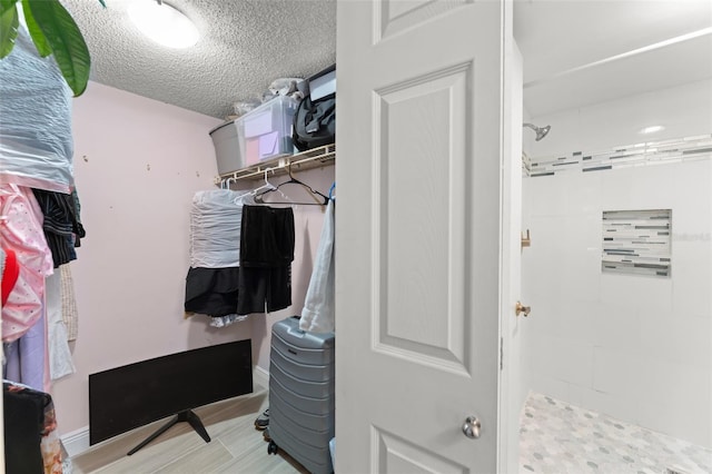 3475 Flossmoor Ave Unit 103, Orlando, FL 32822 - walk in closet featuring light wood finished floors