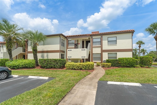 3475 Flossmoor Ave Unit 103, Orlando, FL 32822 - view of property featuring uncovered parking