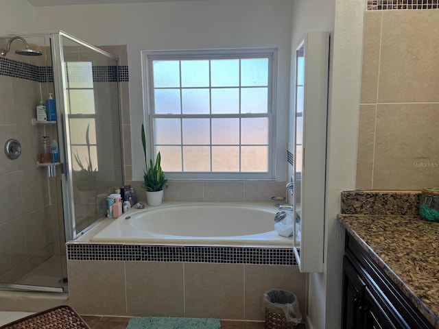 340 Haversham Way, Davenport, FL 33897 - bathroom with a bath, a stall shower, vanity, and tile patterned flooring