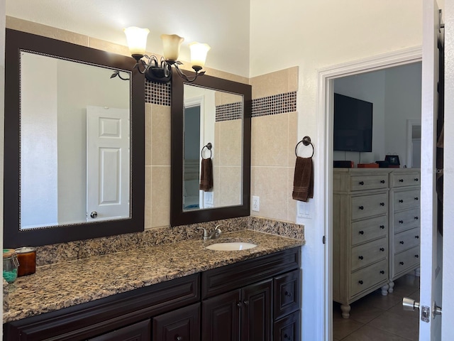340 Haversham Way, Davenport, FL 33897 - bathroom featuring vanity, tile patterned flooring, and tile walls