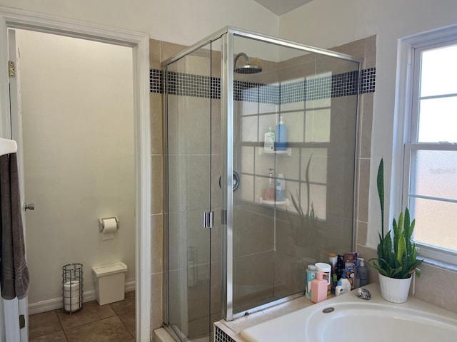 340 Haversham Way, Davenport, FL 33897 - bathroom with a stall shower, a bath, and tile patterned flooring