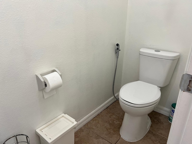 340 Haversham Way, Davenport, FL 33897 - bathroom with toilet, baseboards, and tile patterned floors