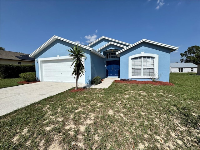 703 Tartan Loop, Lake Wales, FL 33853 - ranch-style house featuring an attached garage, stucco siding, driveway, and a front yard