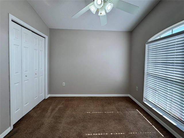 703 Tartan Loop, Lake Wales, FL 33853 - unfurnished bedroom with carpet floors, a closet, ceiling fan, and baseboards