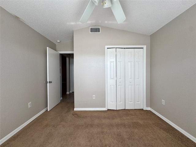 703 Tartan Loop, Lake Wales, FL 33853 - unfurnished bedroom with lofted ceiling, carpet flooring, a closet, baseboards, and ceiling fan
