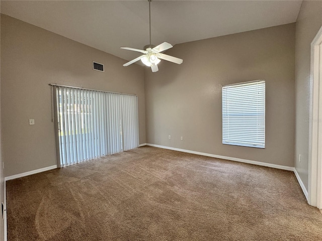 703 Tartan Loop, Lake Wales, FL 33853 - carpeted empty room featuring ceiling fan, vaulted ceiling, baseboards, and healthy amount of natural light