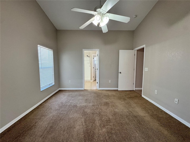 703 Tartan Loop, Lake Wales, FL 33853 - unfurnished bedroom with carpet floors, baseboards, and ceiling fan