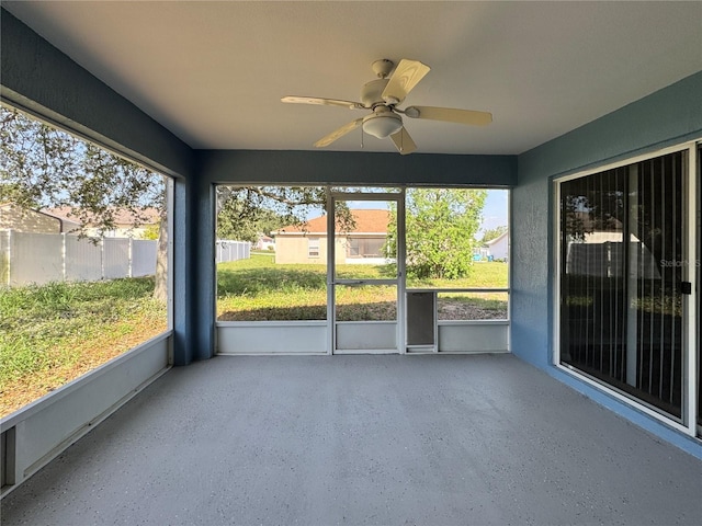 703 Tartan Loop, Lake Wales, FL 33853 - unfurnished sunroom featuring ceiling fan