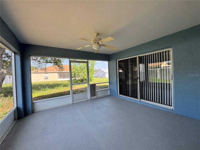 703 Tartan Loop, Lake Wales, FL 33853 - unfurnished sunroom featuring a ceiling fan and plenty of natural light