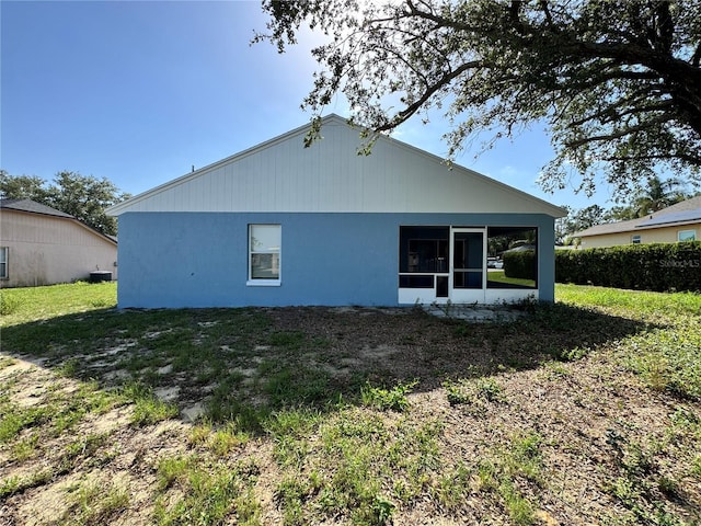703 Tartan Loop, Lake Wales, FL 33853 - back of house featuring a sunroom