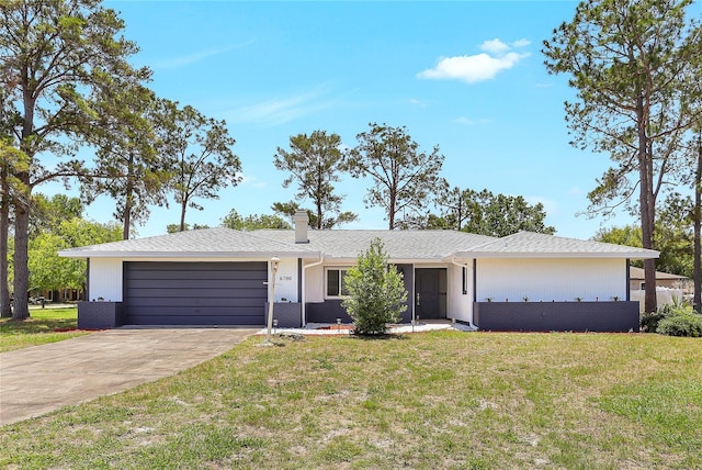 6700 Tamarind Cir, Orlando, FL 32819 - ranch-style home featuring a garage, concrete driveway, a front lawn, and brick siding
