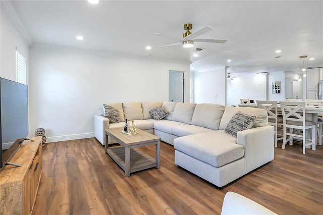 6700 Tamarind Cir, Orlando, FL 32819 - living area with ceiling fan, wood finished floors, recessed lighting, baseboards, and crown molding