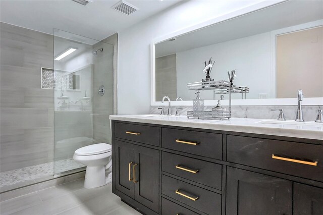6700 Tamarind Cir, Orlando, FL 32819 - bathroom featuring a walk in shower, toilet, and double vanity