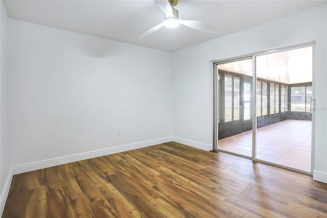 6700 Tamarind Cir, Orlando, FL 32819 - unfurnished room featuring wood finished floors, baseboards, and a ceiling fan