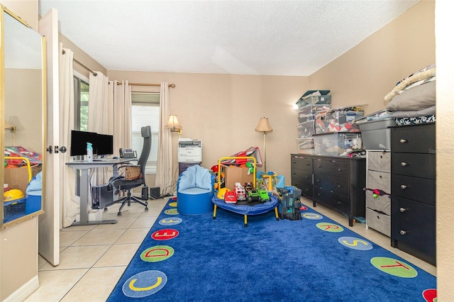 109 Lakepointe Cir, Kissimmee, FL 34743 - playroom with tile patterned floors and a textured ceiling