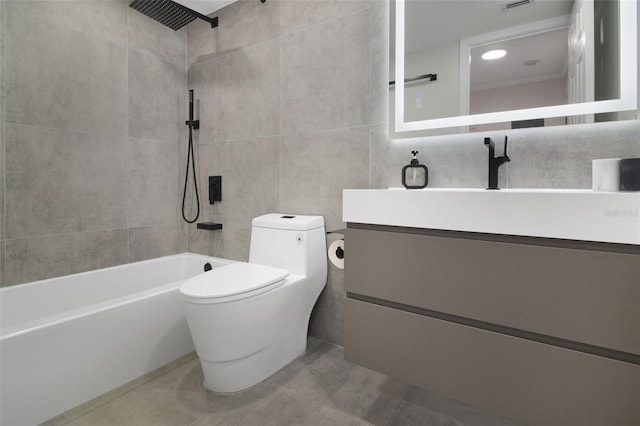 530 E Central Blvd Unit 803, Orlando, FL 32801 - bathroom featuring vanity, toilet, tile patterned floors, tile walls, and  shower combination