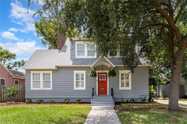 338 E Anderson St, Orlando, FL 32801 - bungalow-style house with a shingled roof and a chimney