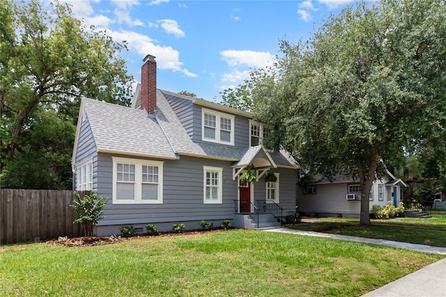 338 E Anderson St, Orlando, FL 32801 - view of front of house with a shingled roof and a chimney