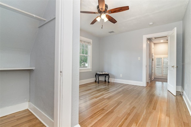 338 E Anderson St, Orlando, FL 32801 - unfurnished bedroom featuring hardwood / wood-style flooring, baseboards, and a ceiling fan