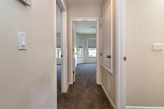1201 Shelter Rock Rd, Orlando, FL 32835 - hallway with dark colored carpet and baseboards